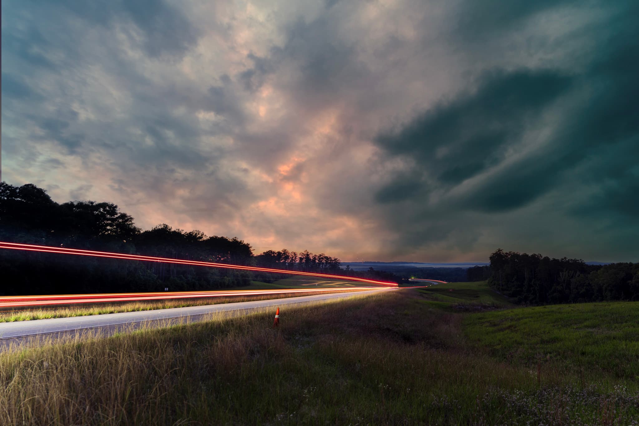 Evening Drive – Light Trails Under a Stormy Sky