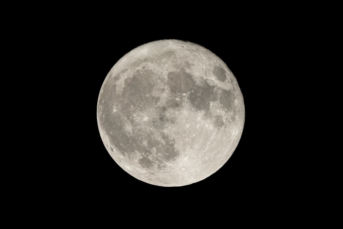 a full moon against a black night sky