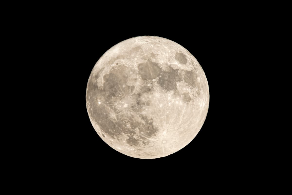 a full moon against a black night sky