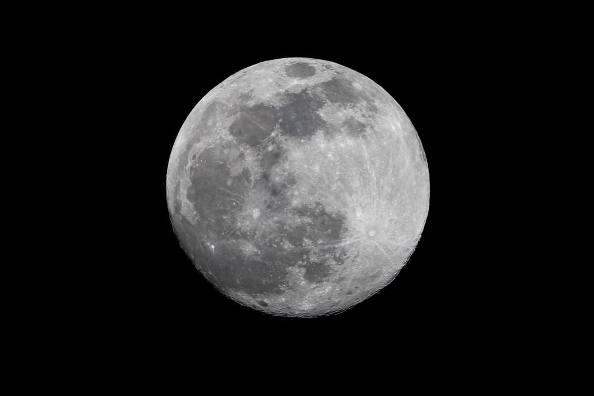 a full moon against a black night sky