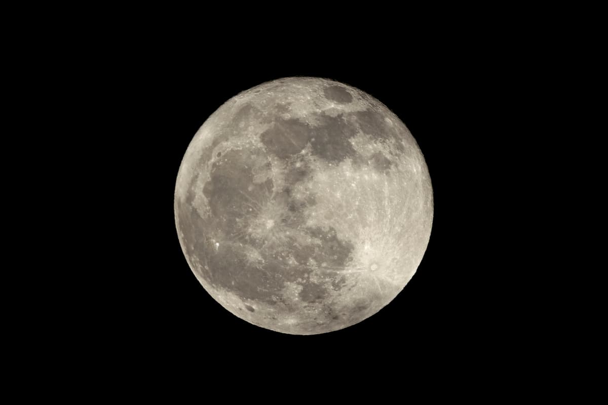 a full moon against a black night sky
