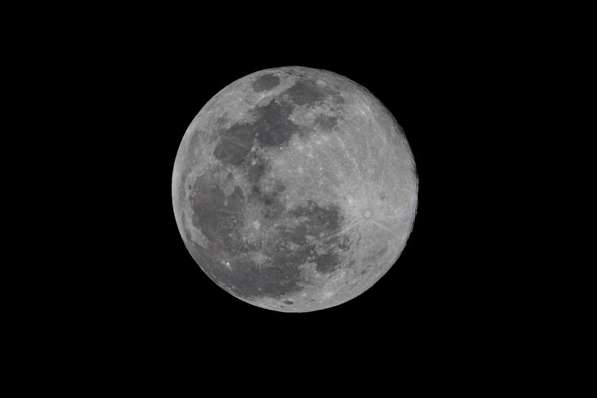 a full moon against a black night sky
