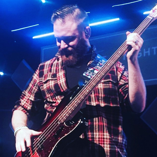 Greg playing bass at Wiregrass Church