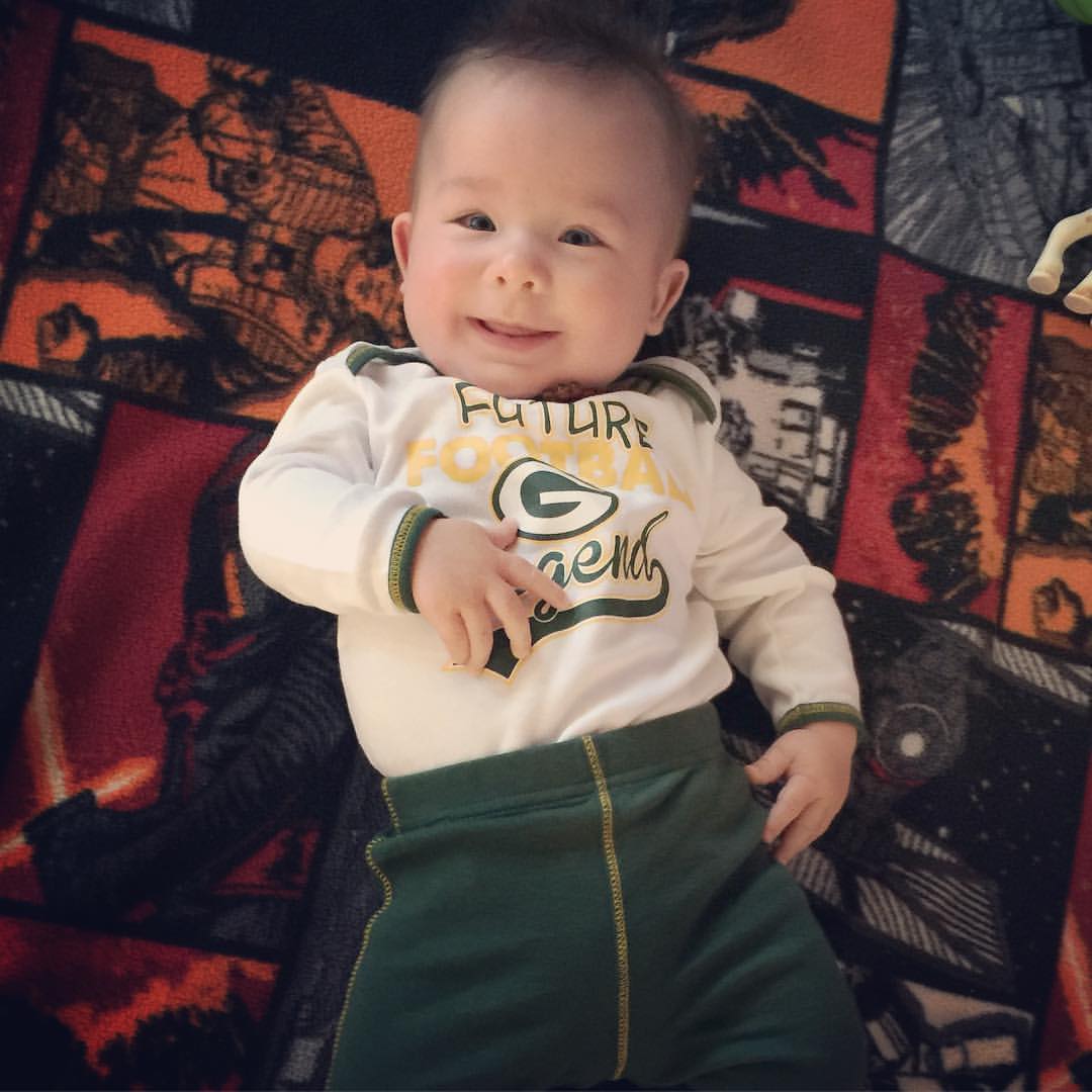 Baby Wyatt in a Green Bay Packers shirt