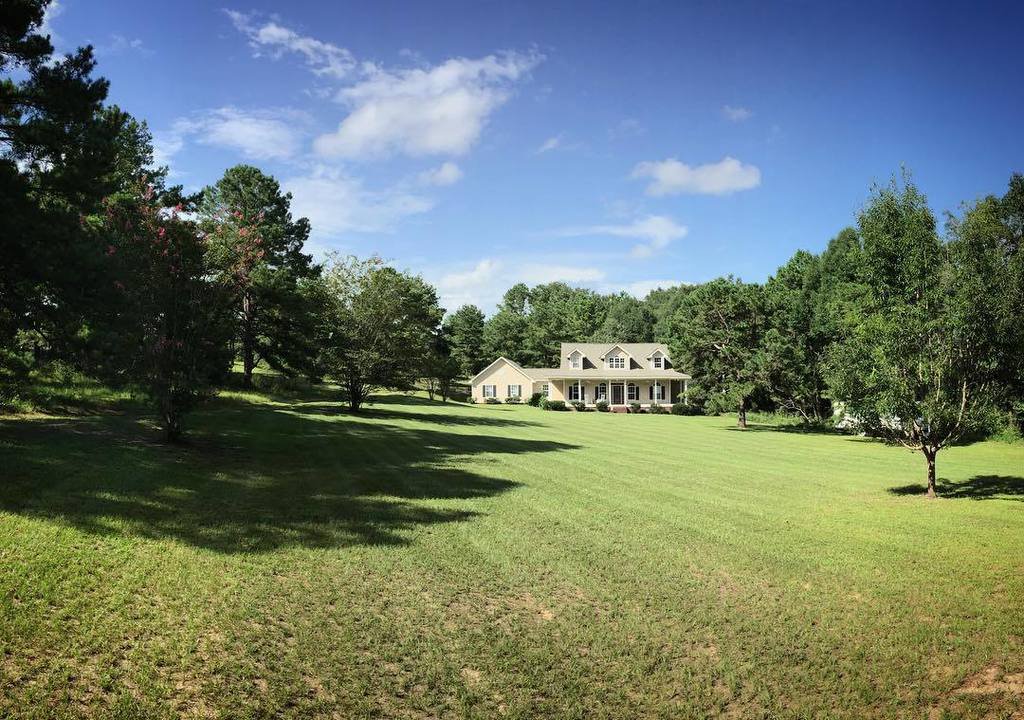 The front yard with diagonal mowing stripes