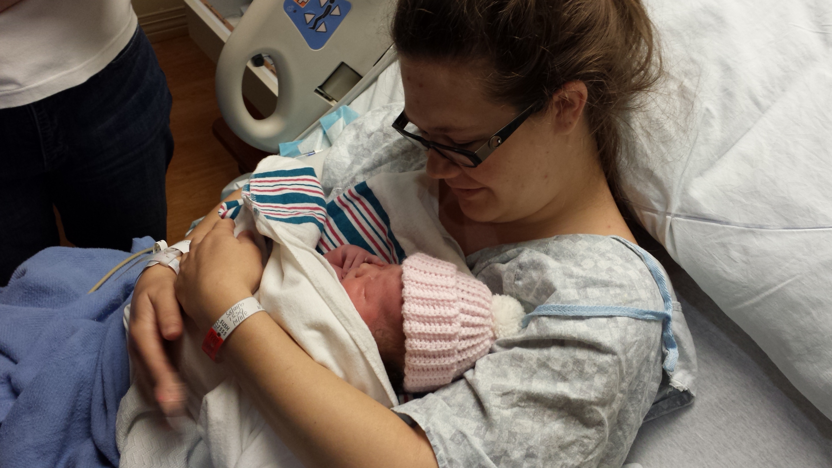 Tara holding Chloe for the first time in the birthing suite