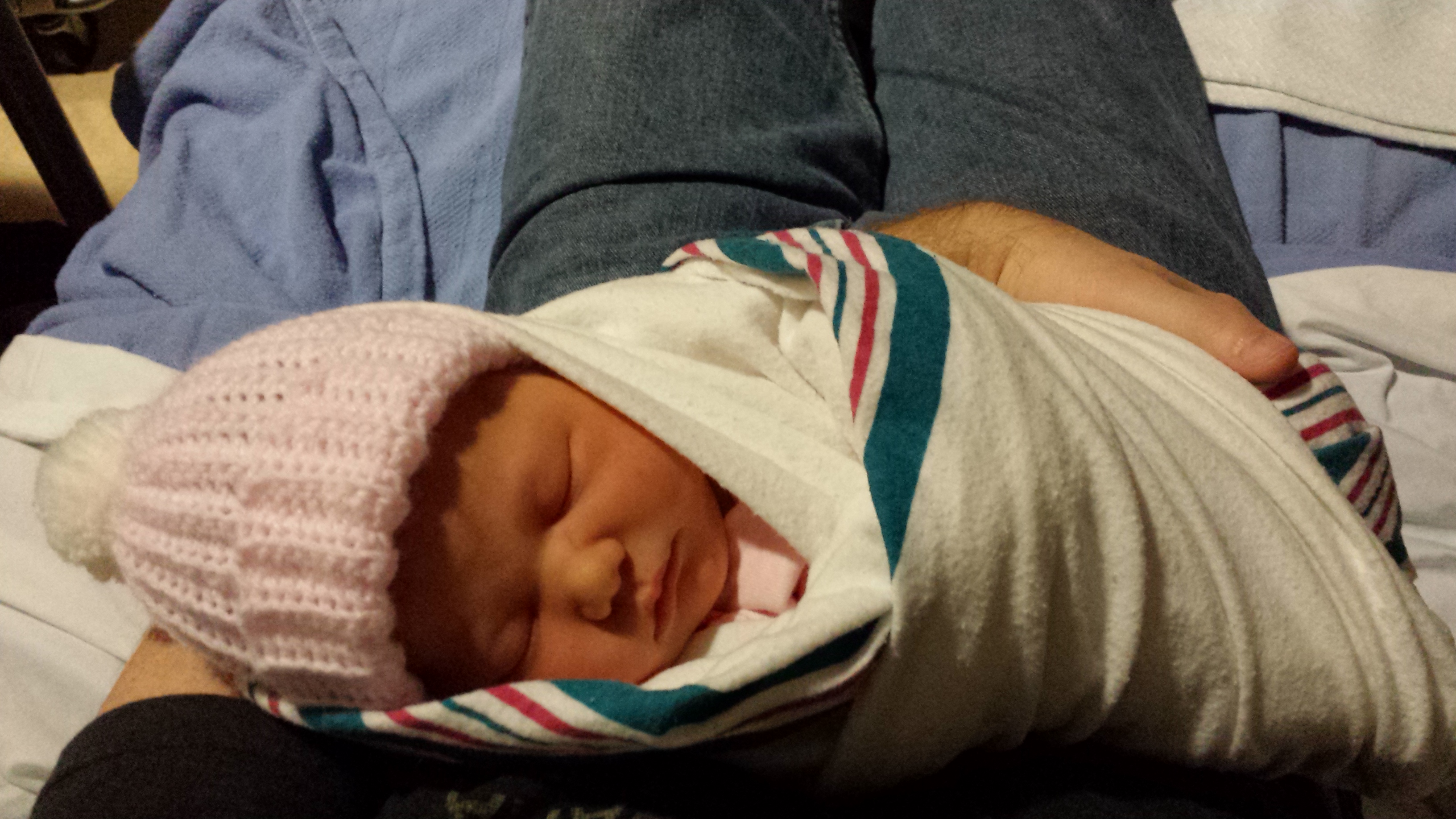 Gregory holding Chloe the evening after her birth